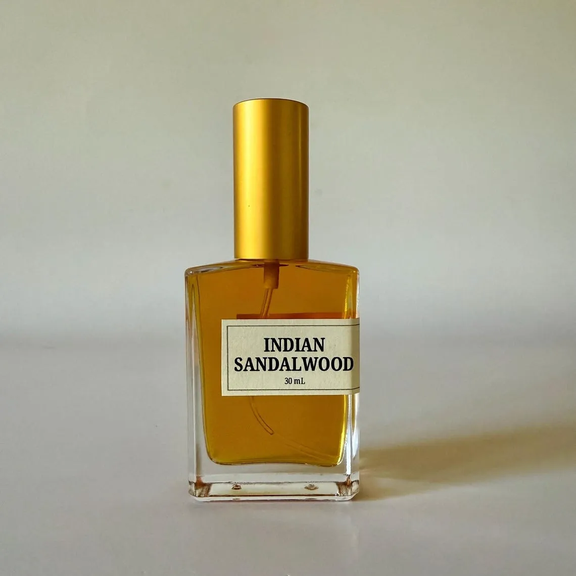 A lipstick on a cluttered table with flat lighting